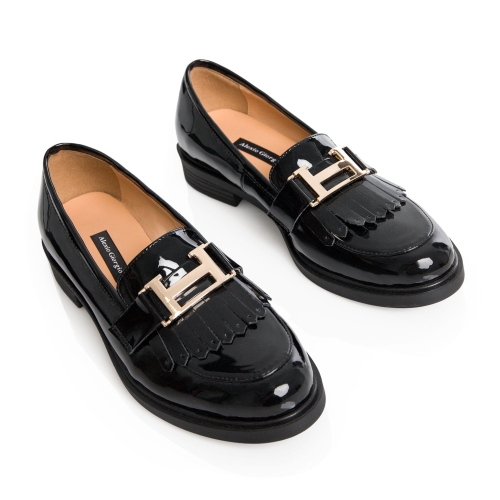 Black moccasins with decorative buckle grain leather